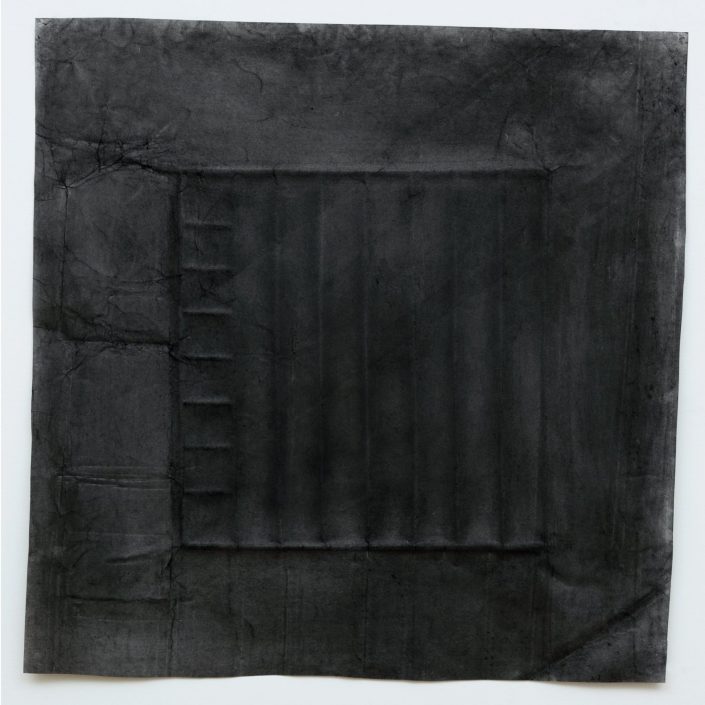 Charcoal on paper rubbing of hidden square structure, paper is reminiscent of a veil due to the drawing process.